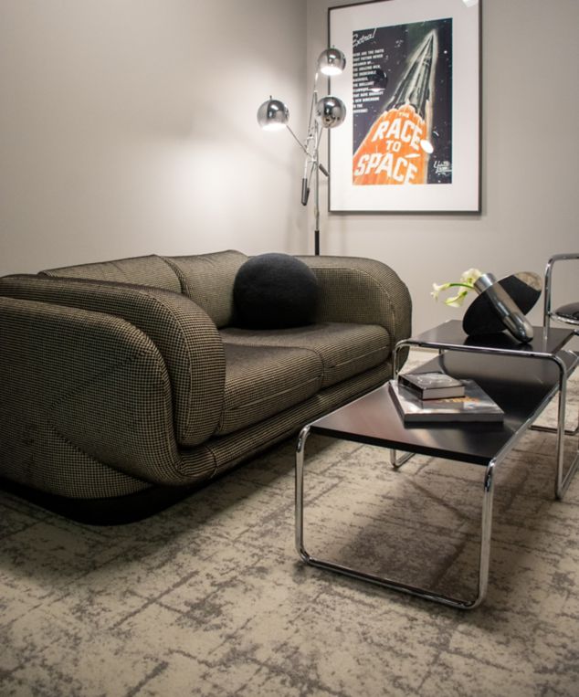 Interface Stellar Horizons carpet tile in room with sofa and coffee table